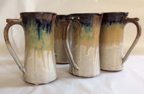 Set of Couttsgrass tall mugs.